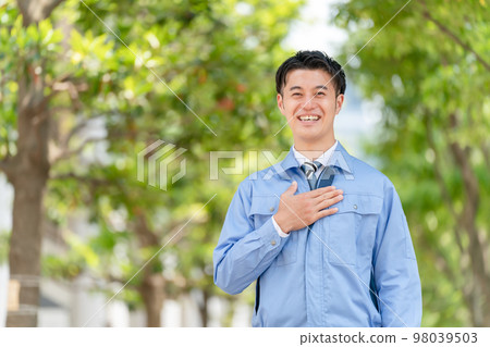 Business image A man in work clothes 98039503