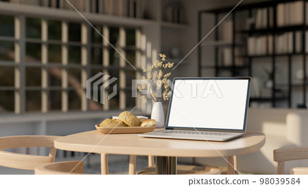 close-up image, Notebook laptop mockup on wood table in modern contemporary living room. close-up image, Notebook laptop mockup on wood table in modern contemporary living room. 98039584