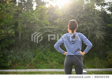 back view, A sport healthy fit Asian woman in sportswear taking a deep breath, resting 98040399