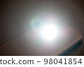 LED Flash or Flashlight of a Smartphone on black background 98041854