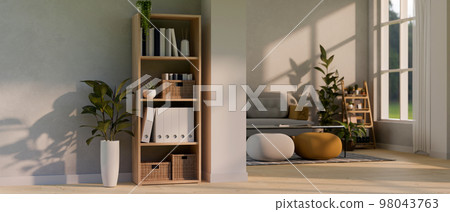 Contemporary and comfortable home living room with shelf, houseplants, sofa, poufs, coffee table 98043763