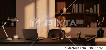 Modern private office room interior with laptop, table lamp, stationery and office supplies on table 98043764