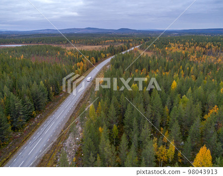 drone footgage Car Camping Caravan driving road lake Swedish Lapland fall ruska colors National Park Sweden 98043913