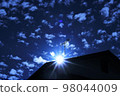 A person looking into the distance from a hill 98044009