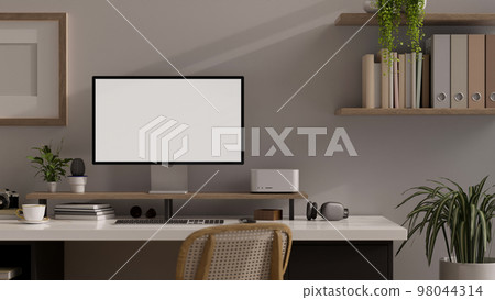 Modern minimal office workspace with computer mockup, white wall with wall shelf, houseplants. 98044314