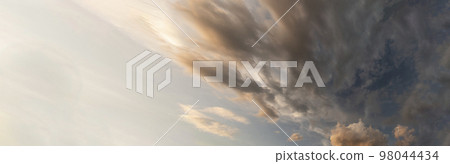 Banner Dramatic dark storm clouds black sky background. Dark thunderstorm clouds rainny season. Panorama Meteorology danger windstorm disasters climate. Dark cloudscape storm cloud with copy space. Banner Dramatic dark storm clouds black sky background. Dark thunderstorm clouds rainny season. Panorama Meteorology danger windstorm disasters climate. Dark cloudscape storm cloud with copy space. 98044434