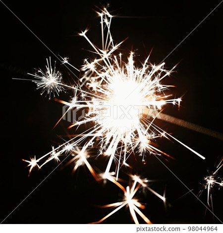 Beautiful abstract shot of sparklers on black background. Beautiful abstract shot of sparklers on black background. 98044964