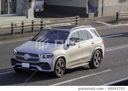 SUV utility vehicle road driving SUV utility vehicle road driving 98045703
