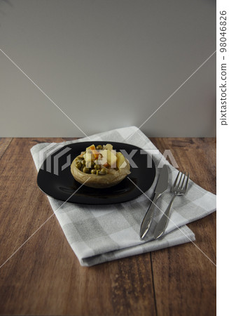 Delicious artichokes on black plate Delicious artichokes on black plate 98046826