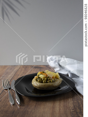 Delicious artichokes on black plate Delicious artichokes on black plate 98046828