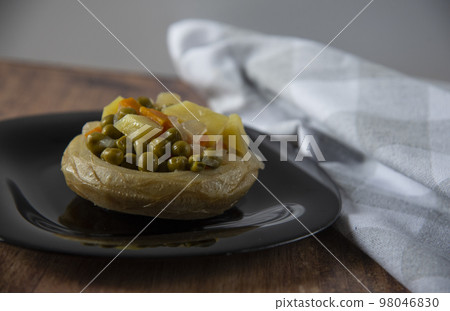 Delicious artichokes on black plate Delicious artichokes on black plate 98046830
