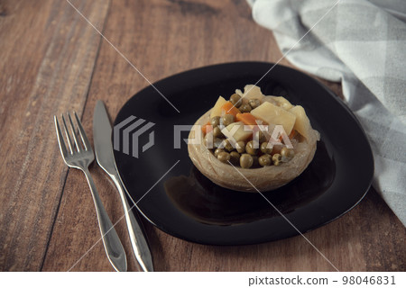 Delicious artichokes on black plate Delicious artichokes on black plate 98046831