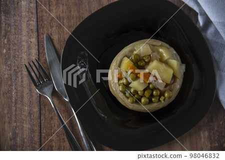 Delicious artichokes on black plate Delicious artichokes on black plate 98046832