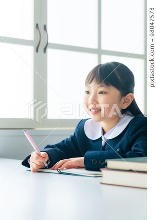 A girl studying in the classroom 98047573