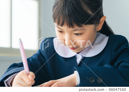 A girl studying in the classroom 98047580