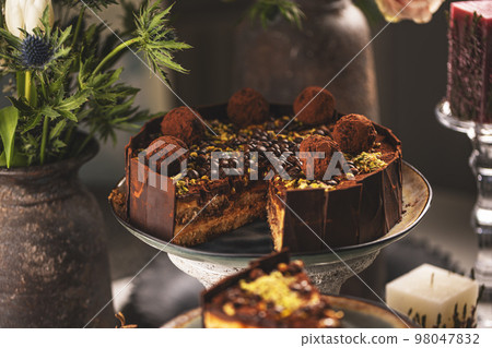 Delicious tiramisu cake with truffle 98047832