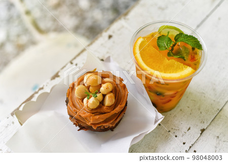 Dessert and drinks, Mixed summer fruit juice and homemade macadamia chocolate cheesecake Dessert and drinks, Mixed summer fruit juice and homemade macadamia chocolate cheesecake 98048003