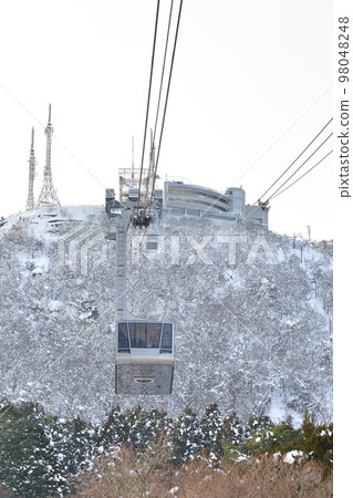 Shoot the landscape of snowy Mt. Hakodate and ropeway in Hakodate, Hokkaido in winter Shoot the landscape of snowy Mt. Hakodate and ropeway in Hakodate, Hokkaido in winter 98048248