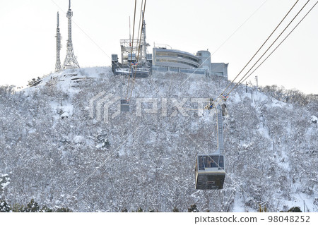 Shoot the landscape of snowy Mt. Hakodate and ropeway in Hakodate, Hokkaido in winter 98048252