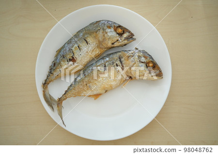 fried fish on white plate 98048762