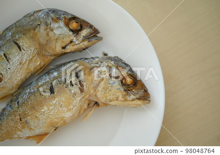 fried fish on white plate 98048764