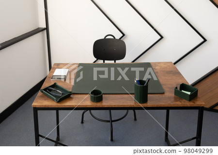 office workplace with green leather sofa office workplace with green leather sofa 98049299