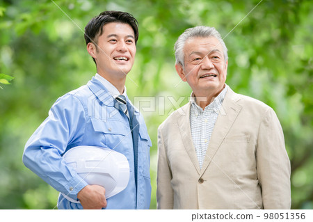 Men in work clothes and senior men Men in work clothes and senior men 98051356