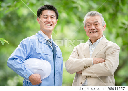Men in work clothes and senior men Men in work clothes and senior men 98051357
