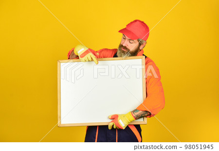 professional skills. architect and engineering drawing. contractor giving presentation. Presentation on flipchart plan for construction. Builder men points on flipchart. Engineer project, copy space 98051945