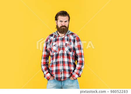 Confident and stylish. confident and strict man in casual checkered shirt. mature bearded man in plaid shirt. handsome man wearing checkered shirt on yellow background. male beauty and fashion Confident and stylish. confident and strict man in casual checkered shirt. mature bearded man in plaid shirt. handsome man wearing checkered shirt on yellow background. male beauty and fashion 98052283