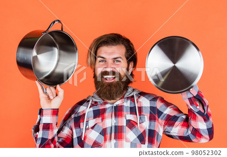 eating healthy. non-stick surface. chef cooking dinner. mature guy in checkered shirt with pan. stylish male going to cook food. bearded man with moustache use kitchen utensils. An amazing experience 98052302