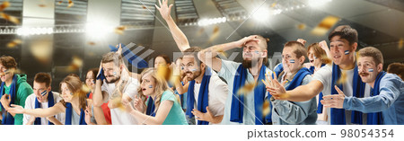 Group of emotive, expressive young people, football, soccer fans cheering team at the stadium. Diversity of emotions. Concept of sport, competition, emotions, hobby 98054354