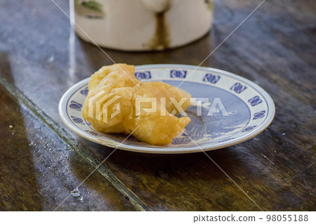 chinese bread stick in a plate on the table chinese bread stick in a plate on the table 98055188