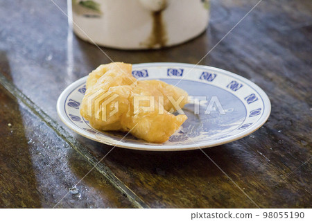 chinese bread stick in a plate on the table chinese bread stick in a plate on the table 98055190