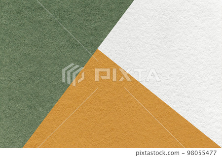 Texture of craft white, olive and orange shade color paper background, macro. Vintage abstract green cardboard 98055477