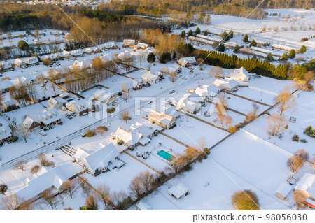 An aerial view of small American town after winter storm with beautiful snowy landscape in South Carolina United States. An aerial view of small American town after winter storm with beautiful snowy landscape in South Carolina United States. 98056030