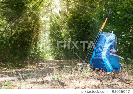 backpack and trekking poles backpack and trekking poles 98056047