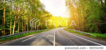 Beautiful background of the asphalt road in spring. 98056490