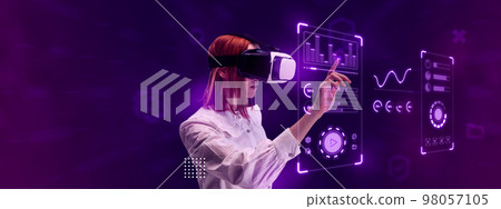Woman, employee wearing VR glasses and working on virtual holographic computer screen. Profile, interface accessibility 98057105