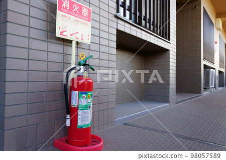 Fire extinguisher placed in the corridor of the apartment Fire extinguisher placed in the corridor of the apartment 98057589
