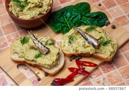 Sandwich with fish pate and sprats. 98057867