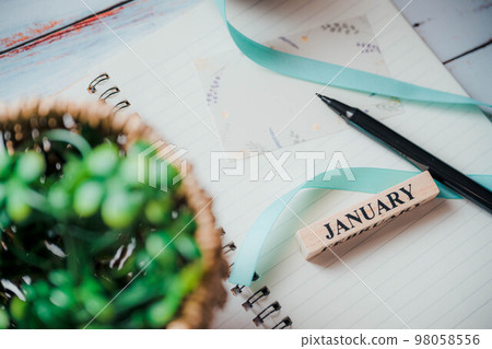 notebook, pen, ribbon and calendar notebook, pen, ribbon and calendar 98058556