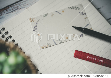 notebook, pen and ribbon notebook, pen and ribbon 98058565