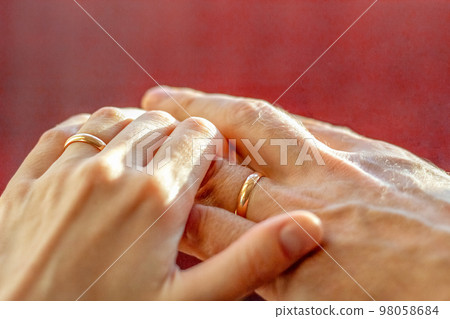 Plexus of male and female hands with wedding rings close-up. valentine's day. Marital love. Wedding, wedding 98058684