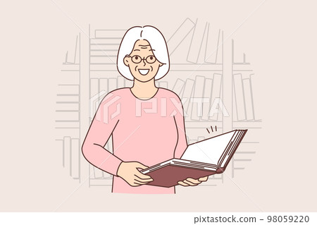 Smiling old woman with book in library Smiling old woman with book in library 98059220