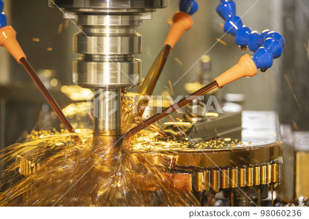 The CNC milling machine cutting the mold parts with oil coolant method. The CNC milling machine cutting the mold parts with oil coolant method. 98060236