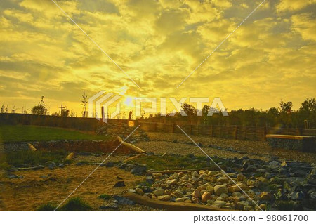 Nature enviromental playground. Environmentally-friendly playground during golden hour Nature enviromental playground. Environmentally-friendly playground during golden hour 98061700