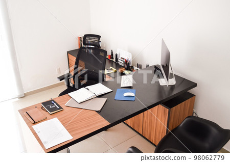 modern designer desk for office, business and creative spaces, Wooden desk in black color with storage drawers. modern designer desk for office, business and creative spaces, Wooden desk in black color with storage drawers. 98062779
