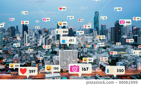 Social media icons fly over city downtown showing people reciprocity connection Social media icons fly over city downtown showing people reciprocity connection 98062899