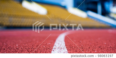path for runners. racetrack on outdoor stadium. stadium arena soccer field. healthy sports life. treadmill in gym. running track in selective focus. finish line. health and sport 98063197
